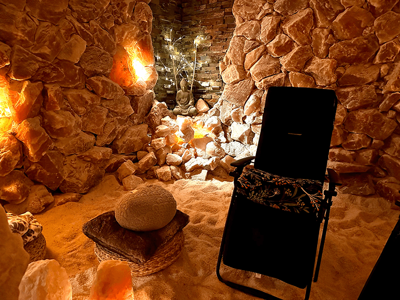 Guests relaxing during a community salt cave session